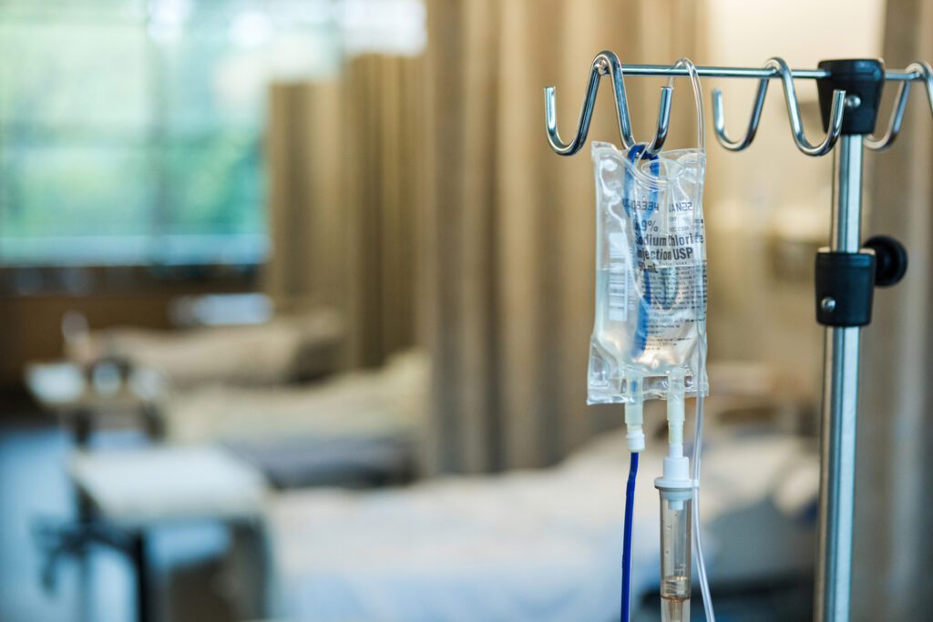 IV drip in a hospital room setting.
